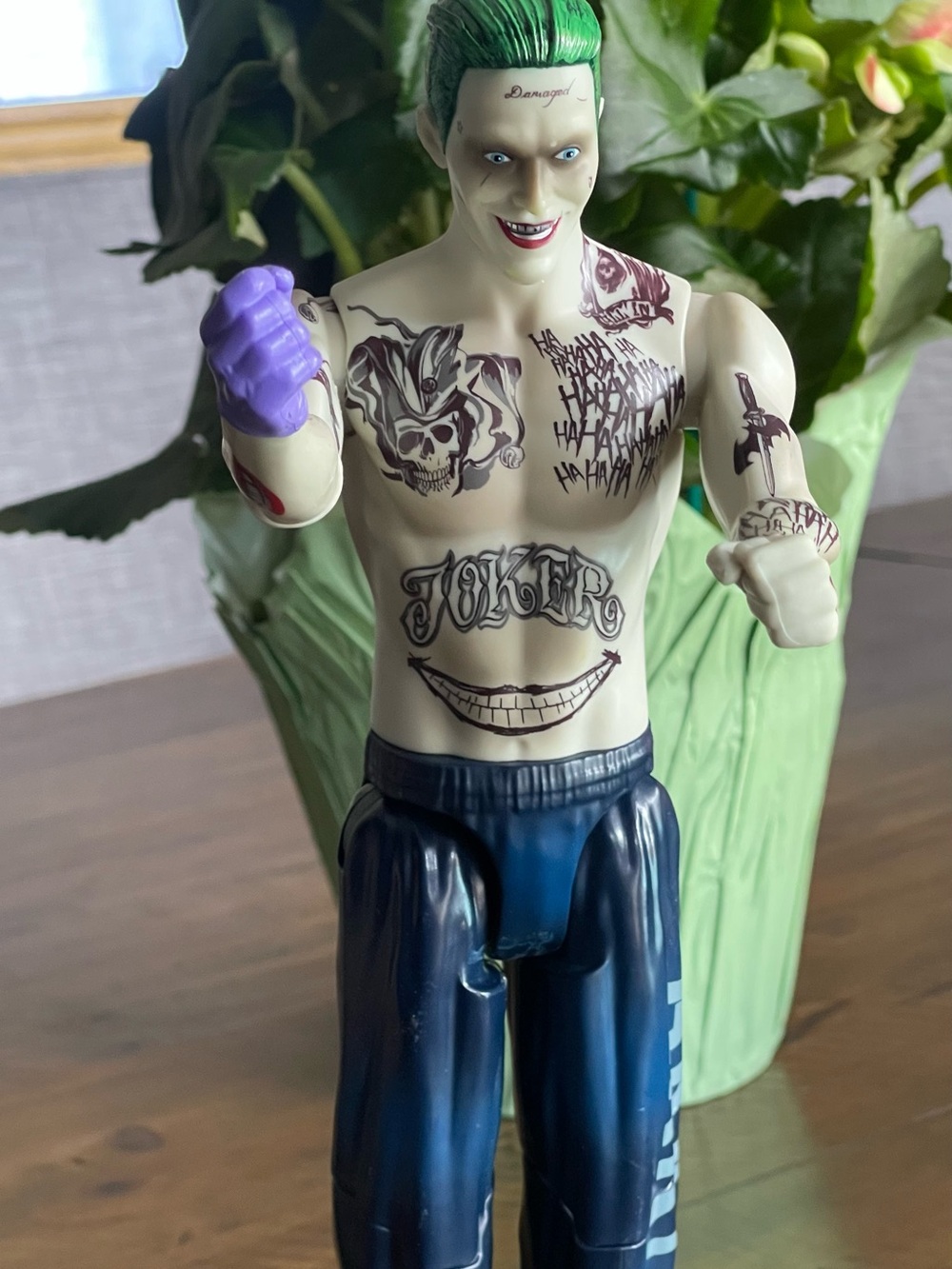The Joker Tattooed Action Figure with Navy Pants and Purple Glove